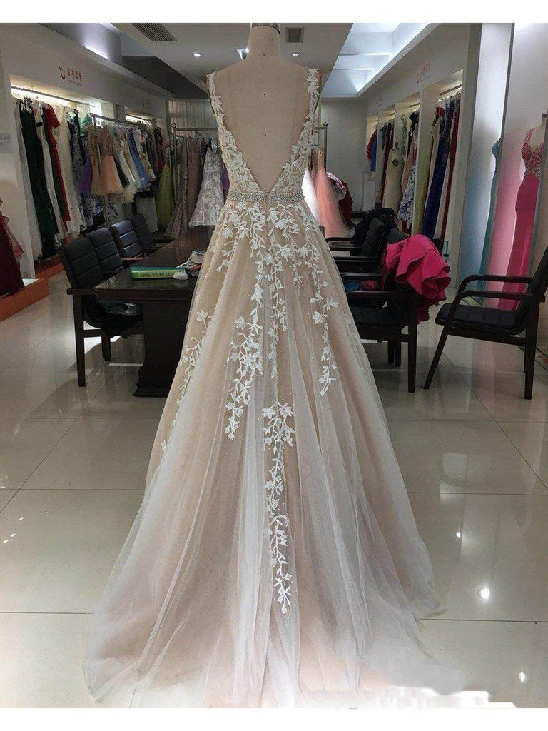 Shop the Stunning Champagne A-Line Applique Beaded V-Neck Sleeveless Tulle Prom Dress at JLDressCA Shop the Stunning Champagne A-Line Applique Beaded V-Neck Sleeveless Tulle Prom Dress at JLDressCA